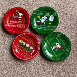 NWT.  Gibson Peanuts set of 8 colorful Christmas Plates.  Lightweight melamine.
